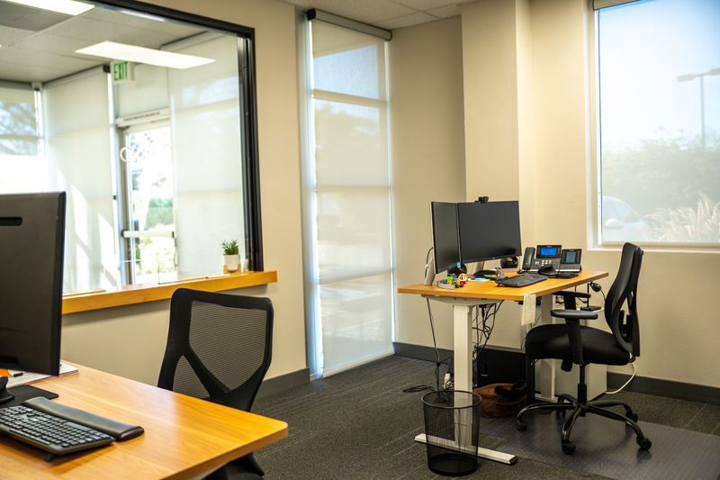 Furnished office with sit-stand desks