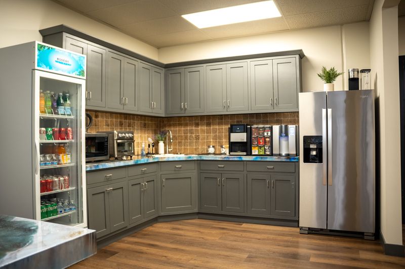 Kitchen with drink fridge and appliances